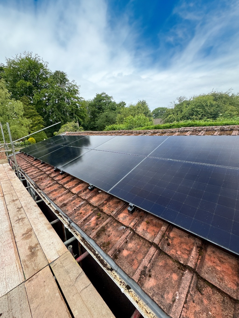 Solar panels being installed on a roof